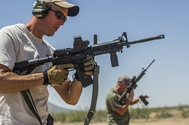 Shooters line up to fire during the brass vs. steel test.